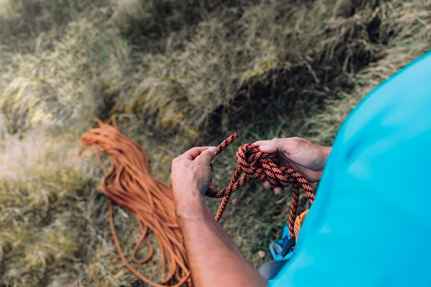 Climber with rope in hands