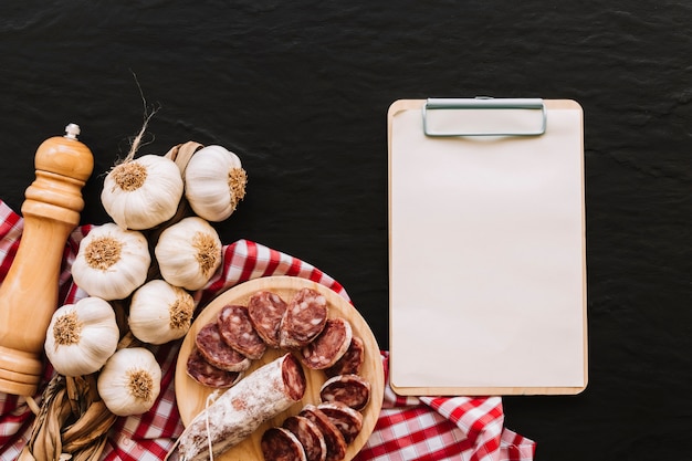 Clipboard near food and napkin