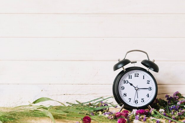 Clock and different flowers