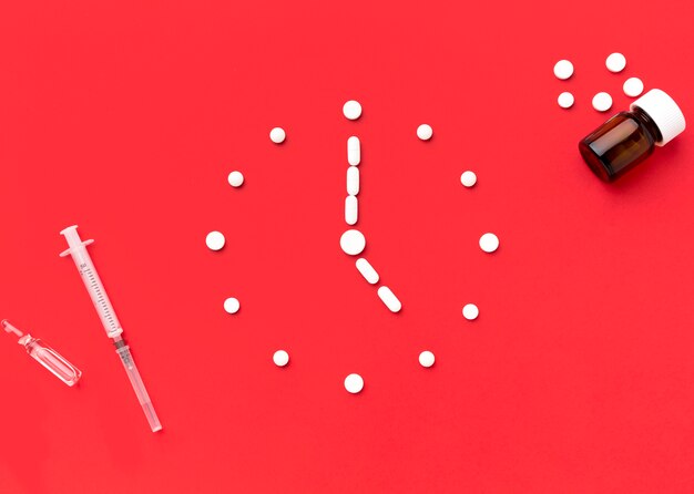 Clock shape of pills on desk