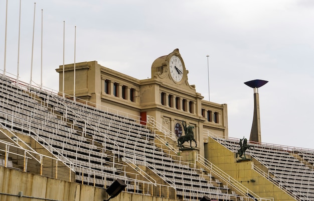 Clock with arch inside Estadi Olimpic de Montjuic home of the 1992 Summer Olympics.