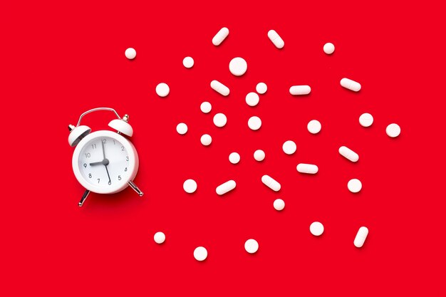 Clock with pills beside