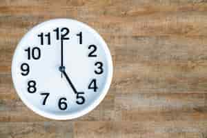 Free photo clock on wood background