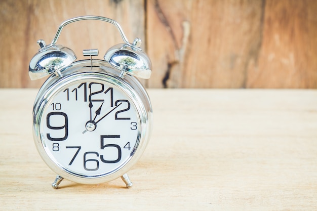 Clock on wood background