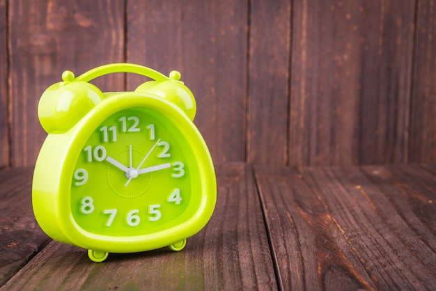 Clock on wood background