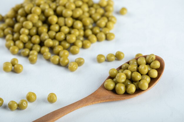 Cloe up photo of green marinated peas.