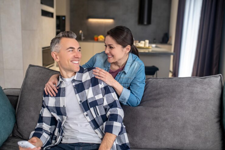 Free Photo close people young adult woman touching shoulders of man looking at each other