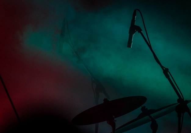 Close shot of a microphone near the drum with smoke