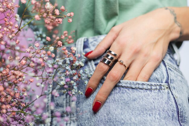 Close shot of  woman hand fingers wearing two rings