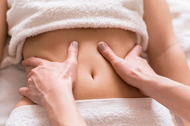 Close-up abdomen massage concept