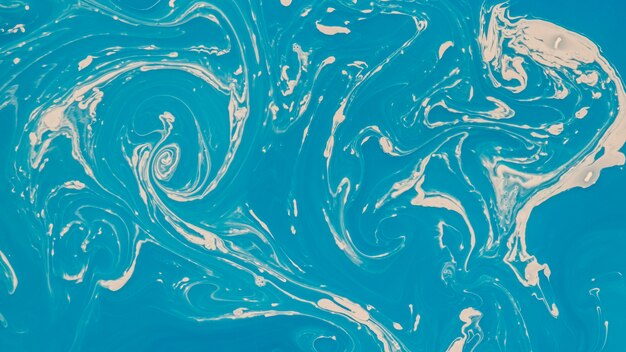 Close-up abstract blue mixing acrylic paint background