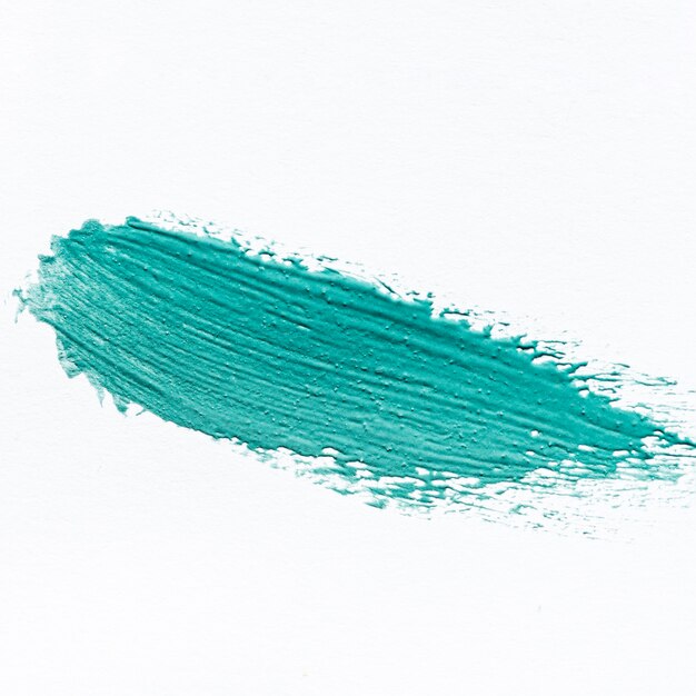 Close-up of abstract blue paint brush stroke on surface