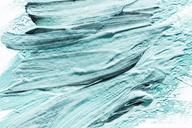 Close-up of abstract blue paint brush strokes on surface