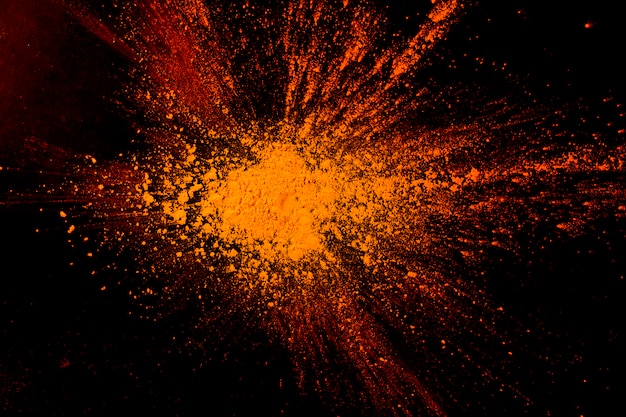 Close-up of abstract orange powder paint background