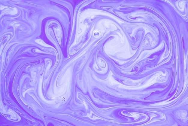 クローズアップの抽象的な紫色の混合アクリル絵の具を背景として使用