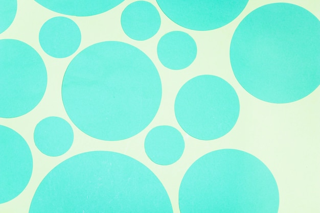 Close-up of abstract turquoise circle on colored backdrop