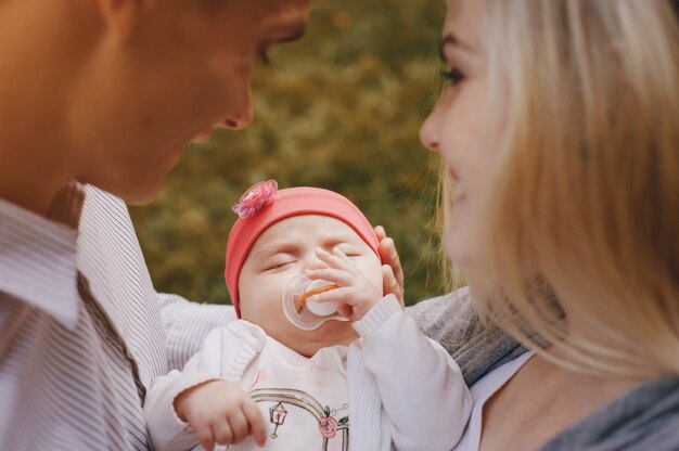 Close-up of adorable baby with hand on her face