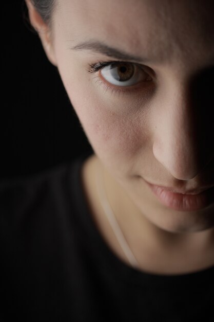 Close-up of adorable woman with brown eyes