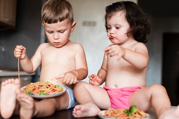 Free photo close-up adorable young siblings