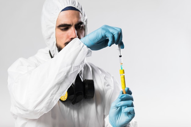 Close-up adult male preparing medical treatment