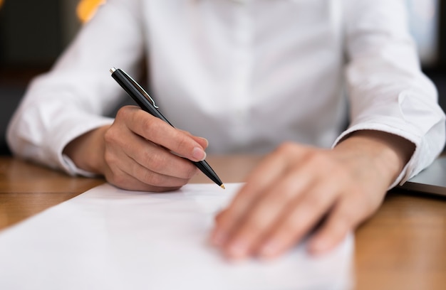 Close-up adult ready to sign papers