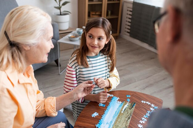 Close up adults and kid with puzzle