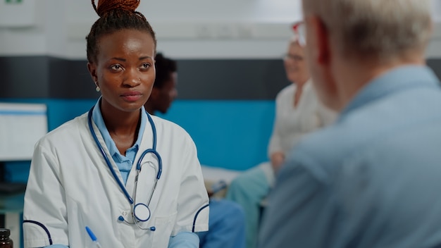 Close up of african american doctor doing consultation