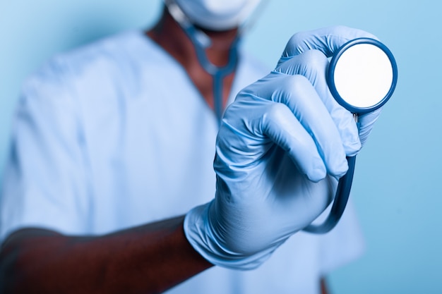 Close up of african american hand holding stethoscope