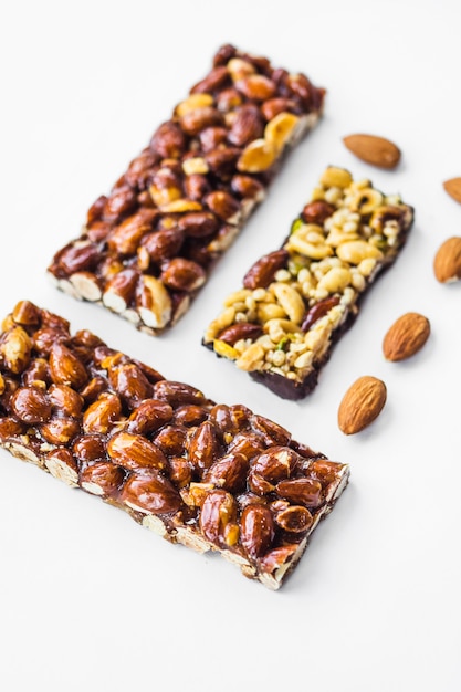 Close-up of almonds bar on white background