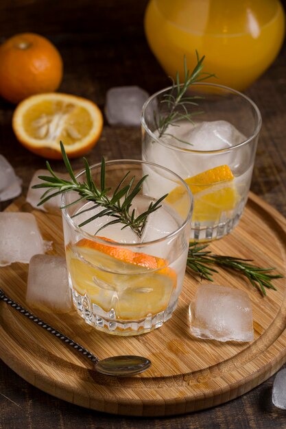 Close-up aromatic beverages with rosemary and orange