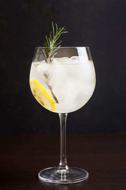 Close-up aromatic cocktail glass with rosemary