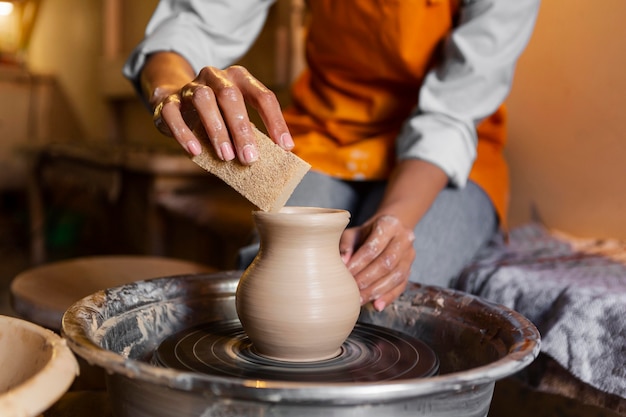 Close up artist doing pottery