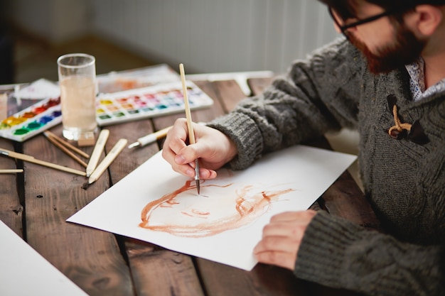 Close-up of an artist using a brush