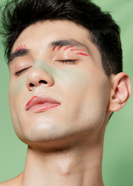 Free photo close-up of artistic pain on man face