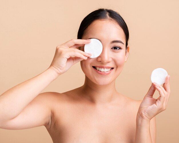 Close-up asian woman with cotton pads