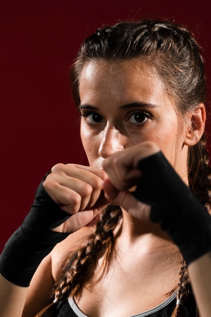 Close-up athletic woman in fitness clothes