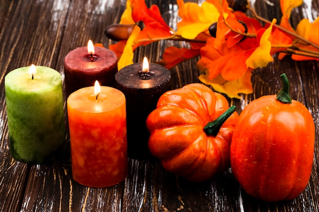 Close-up autumn decorations with candles