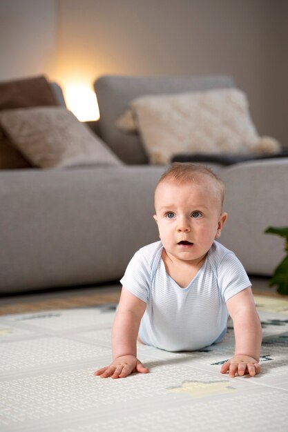 Close up on baby crawling and learning to walk