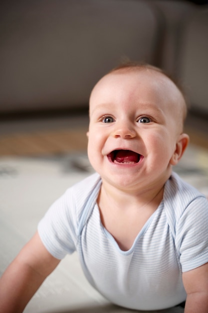 Close up on baby crawling and learning to walk