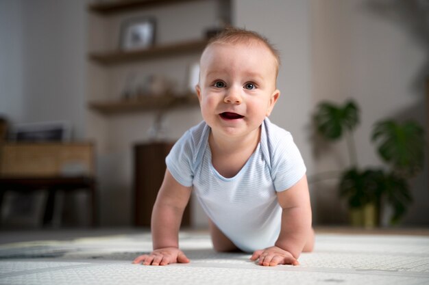 Close up on baby crawling and learning to walk