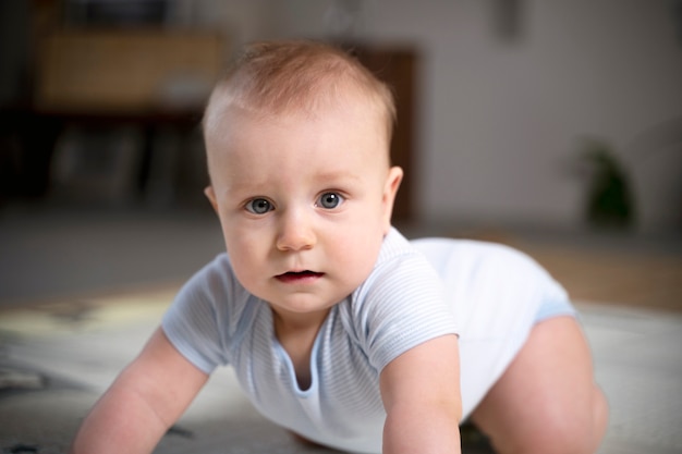 Free photo close up on baby crawling and learning to walk