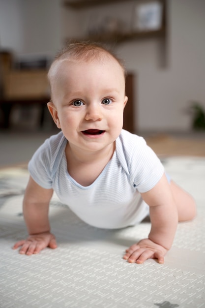 Close up on baby crawling and learning to walk