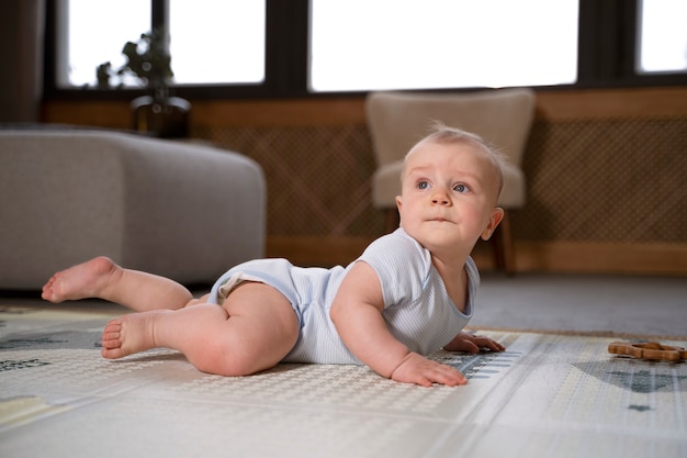 Close up on baby crawling and learning to walk