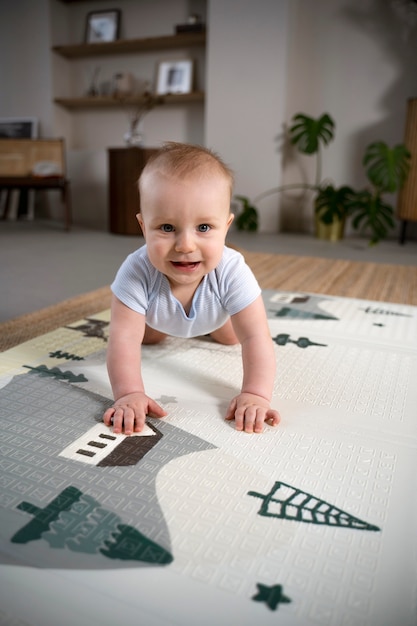 Close up on baby crawling and learning to walk