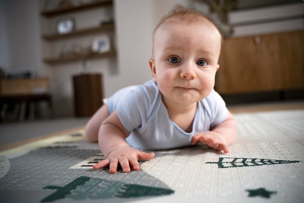 Close up on baby crawling and learning to walk