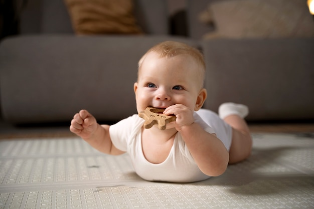 Close up on baby crawling and learning to walk