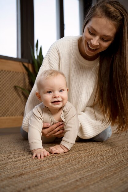 Close up on baby crawling and learning to walk