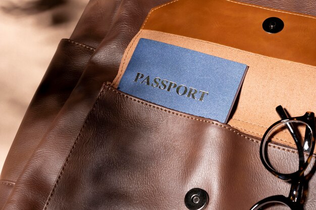 Close up backpack with passport and glasses