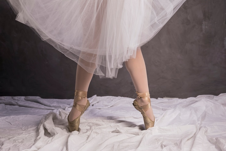 Free Photo close up ballerina in ballet shoes and skirt