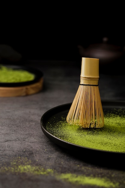 Close-up of bamboo whisk on plate with copy space